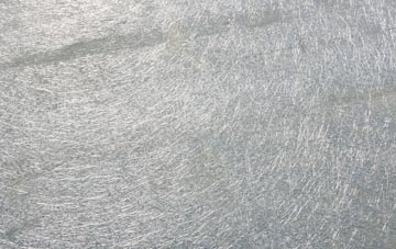 Suisnish laminate fibreglass or shingles?